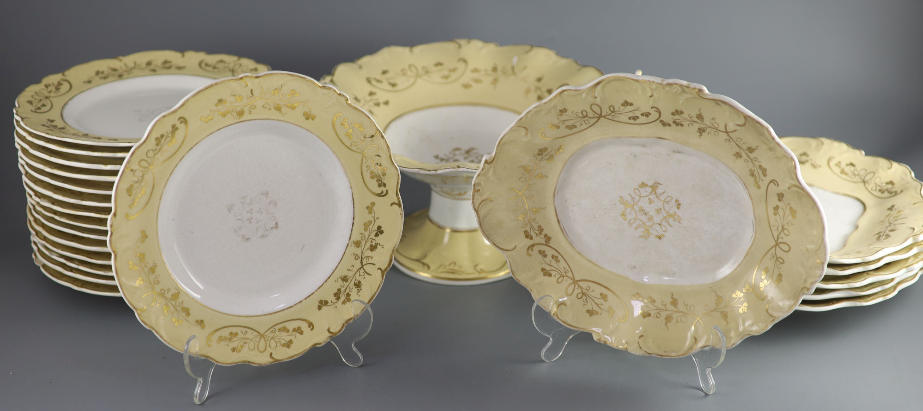 A Staffordshire cream and gilt twenty one piece part dessert service,